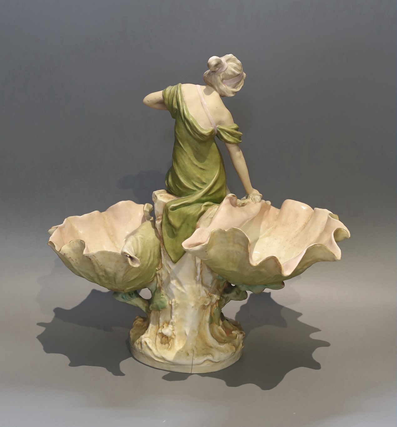 A Royal Dux porcelain centrepiece, modelled as a fisherwoman with scallop shells, height 41cm
